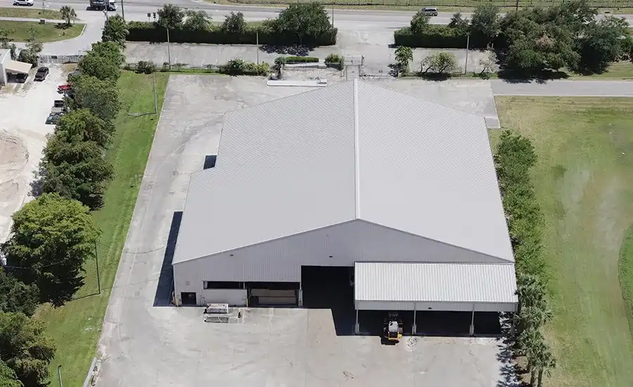 Commercial warehouse metal roof aerial view