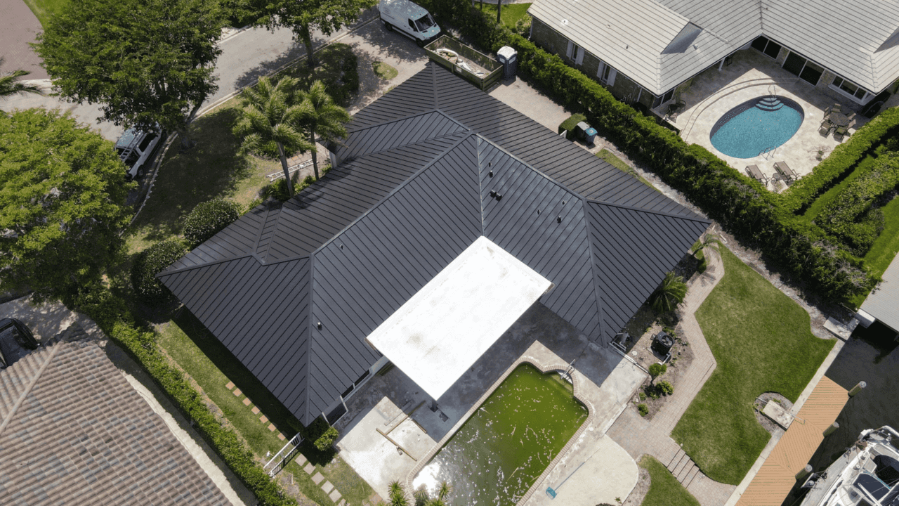Dark metal roof home aerial view