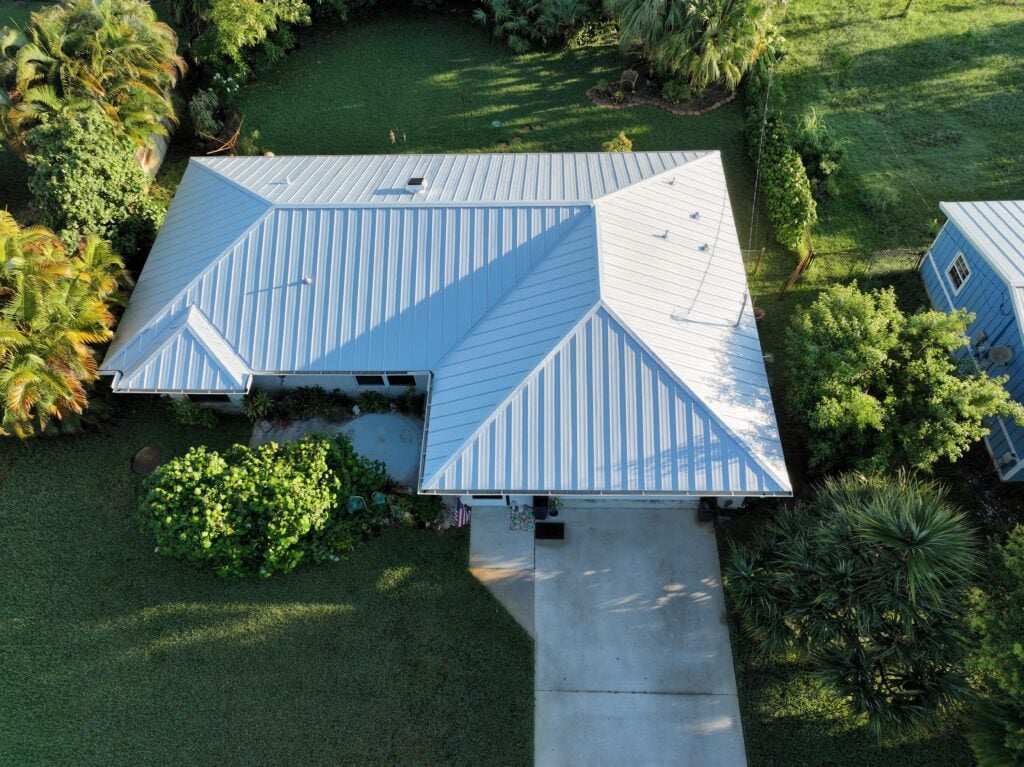 Light blue metal roof home aerial view