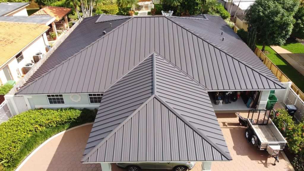 Dark standing seam metal roof residential aerial